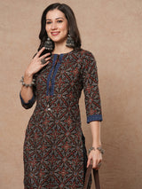 Straight fit printed kurta with smocking panel in the centre and sleeves and neck tie-up with trims