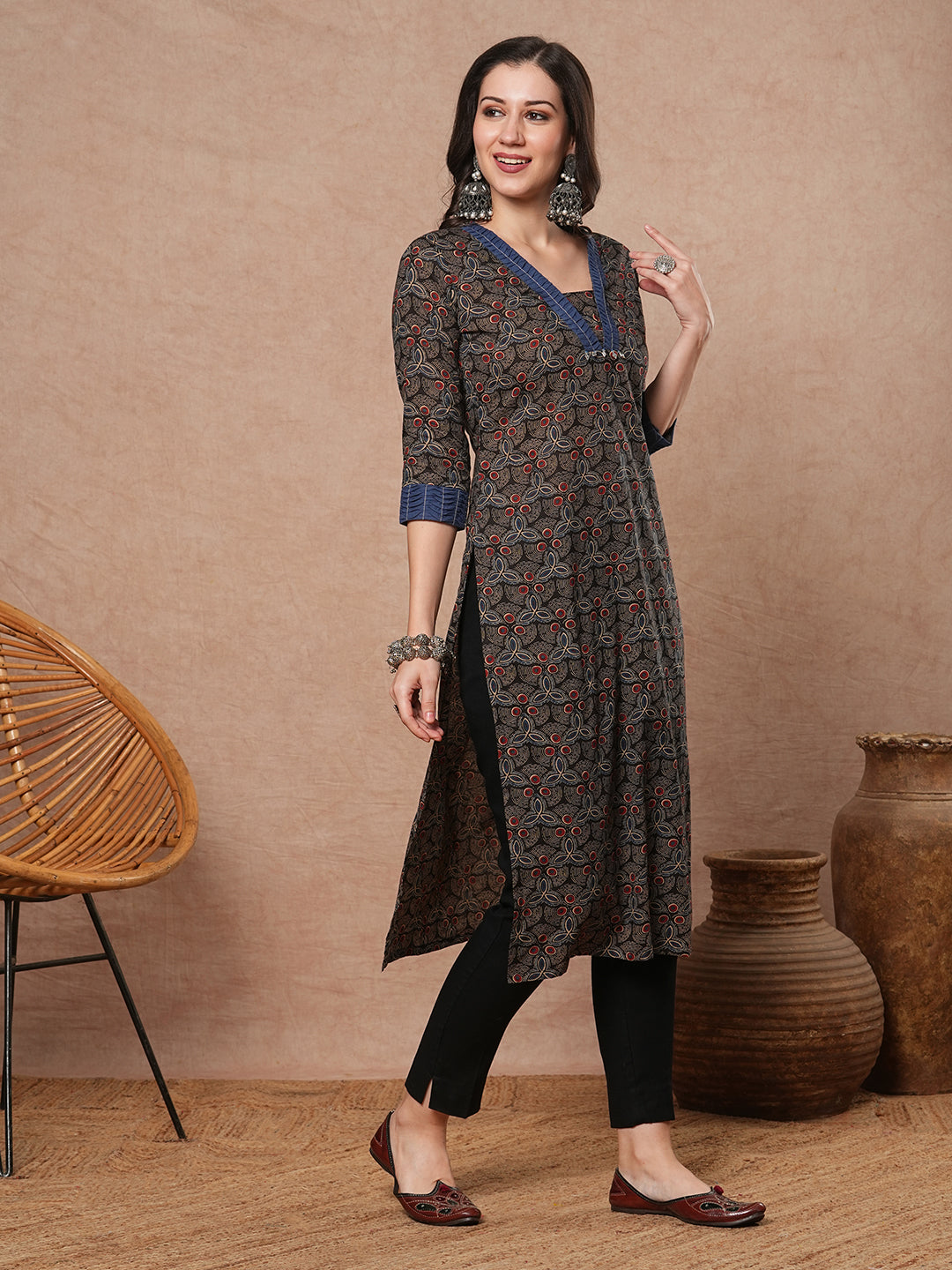 Straight fit printed kurta with contrast fabric smocking on neckline and cuff and silver trims