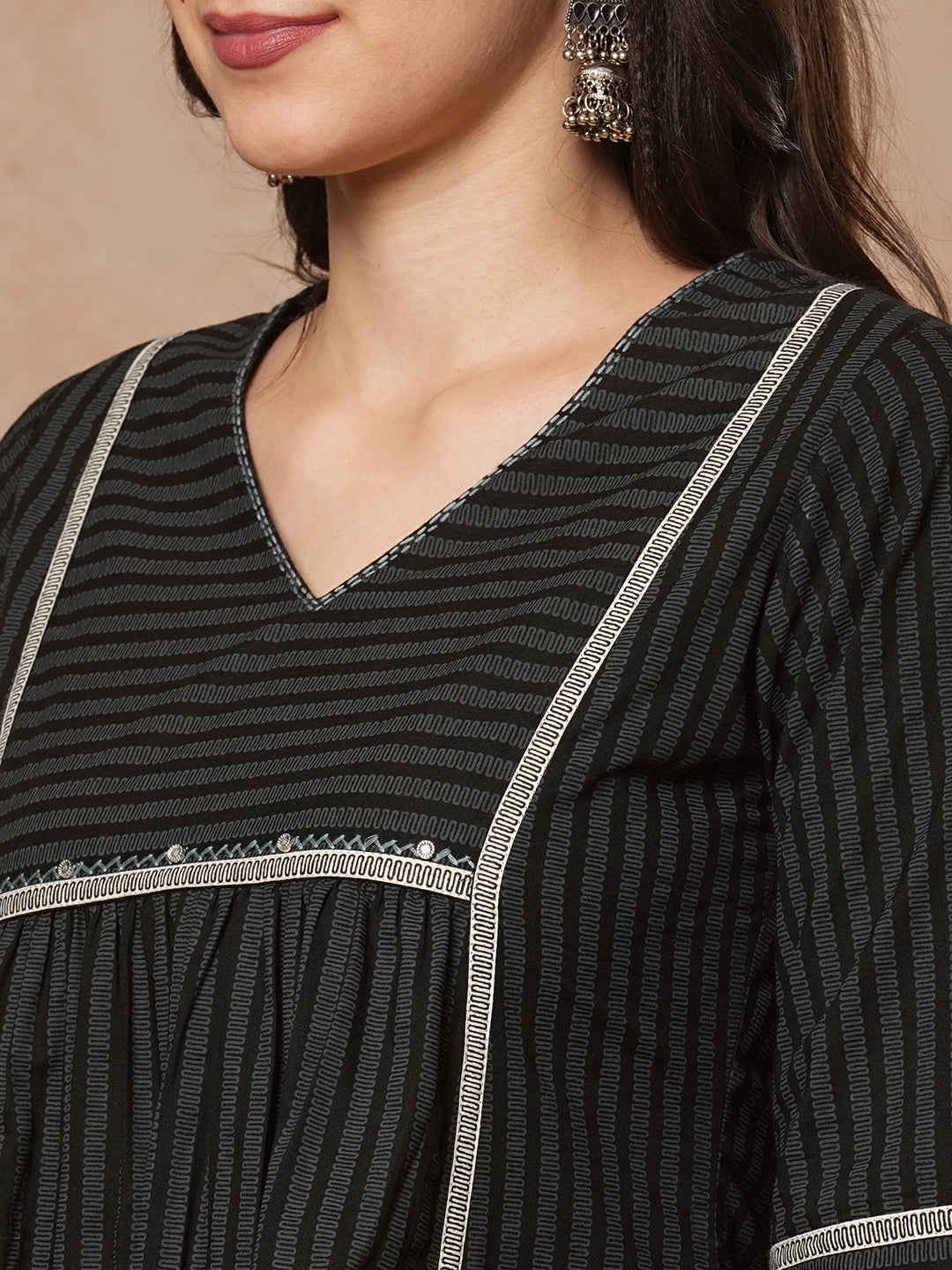 A-line shoulder princess kurta with under-bust gathers with contrast fabric trims and handwork