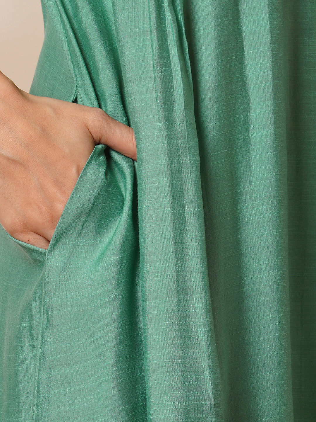 Party Edit- Pleated A-line silk blend kurta with embroidery and pocket, paired with lined silk blend pants