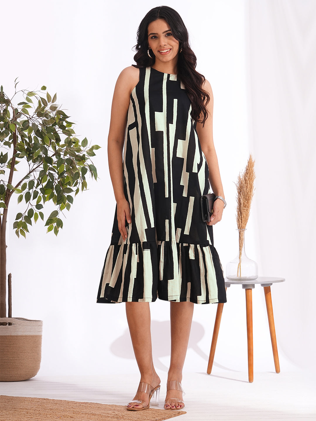 A-Line sleeveless cotton print dress with a tiered hemline and an attached in seam pocket
