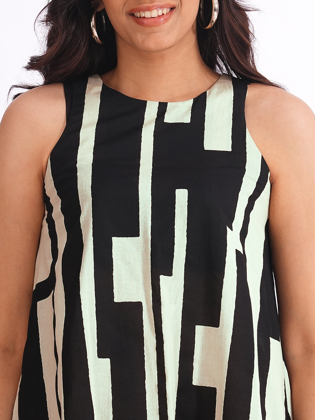 A-Line sleeveless cotton print dress with a tiered hemline and an attached in seam pocket