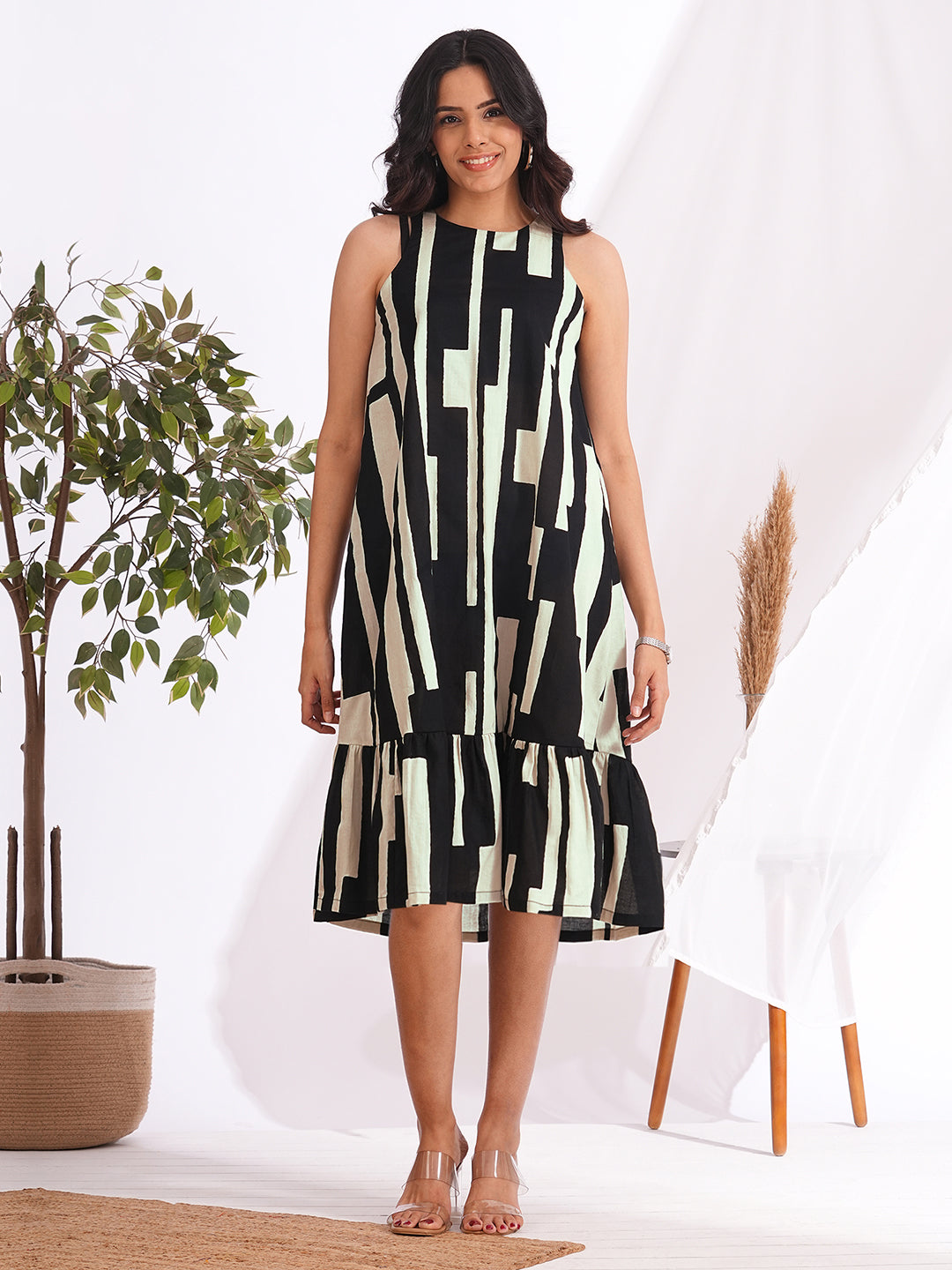 A-Line sleeveless cotton print dress with a tiered hemline and an attached in seam pocket