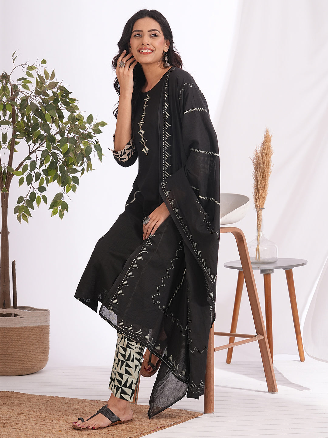 Straight fit suit set features a cotton block printed top adorned with a printed bottom & printed dupatta.
