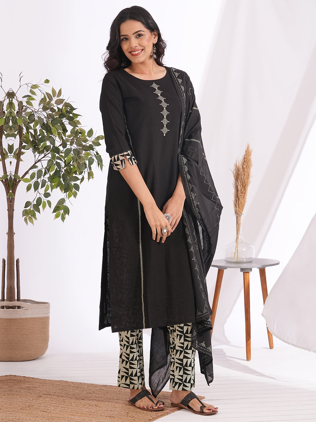 Straight fit suit set features a cotton block printed top adorned with a printed bottom & printed dupatta.