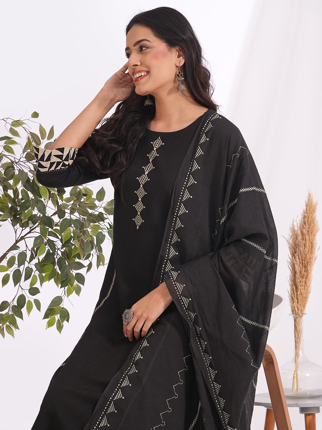 Straight fit suit set features a cotton block printed top adorned with a printed bottom & printed dupatta.