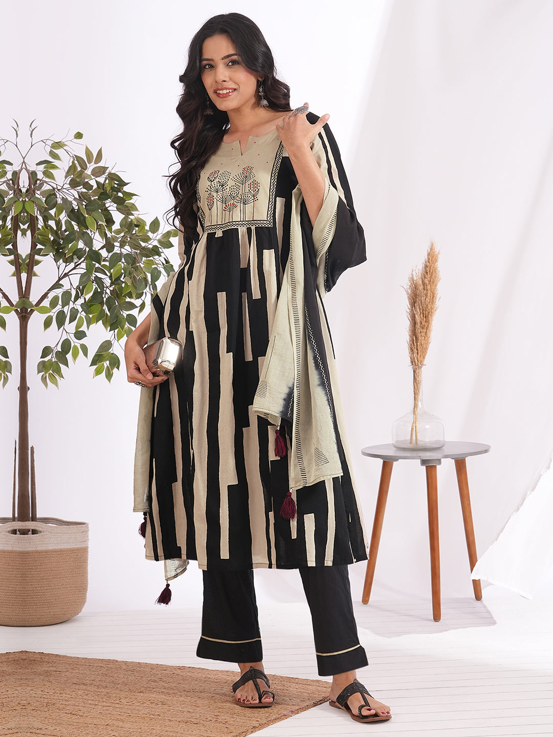 A-line printed suit set paired with a solid bottom and block printed mal dupatta.