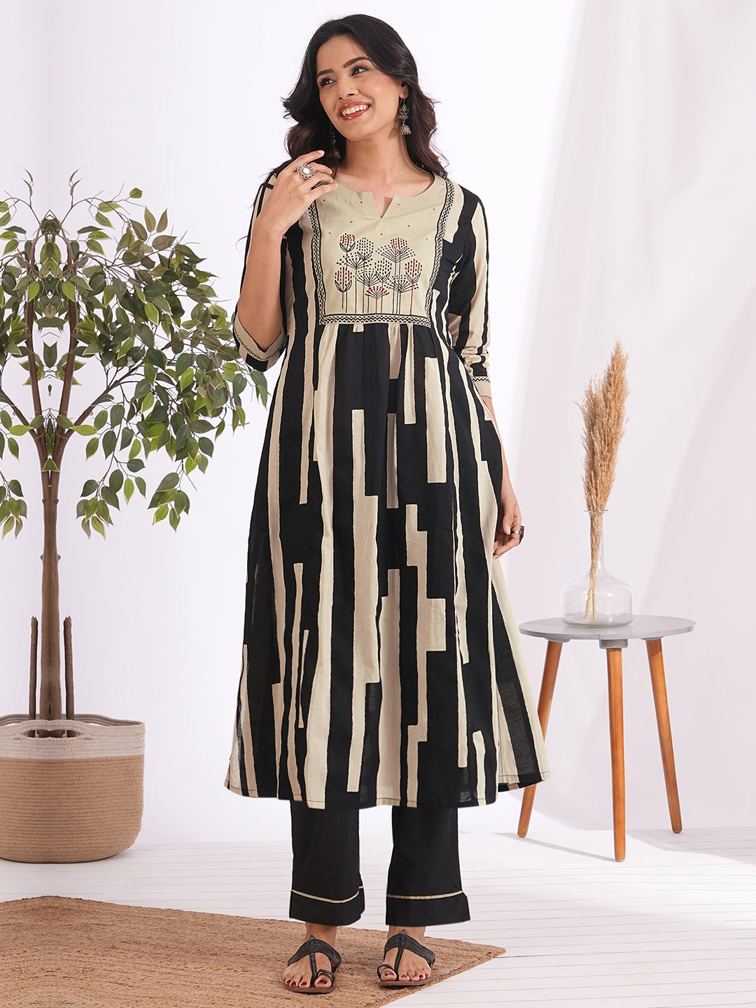 A-line printed suit set paired with a solid bottom and block printed mal dupatta.