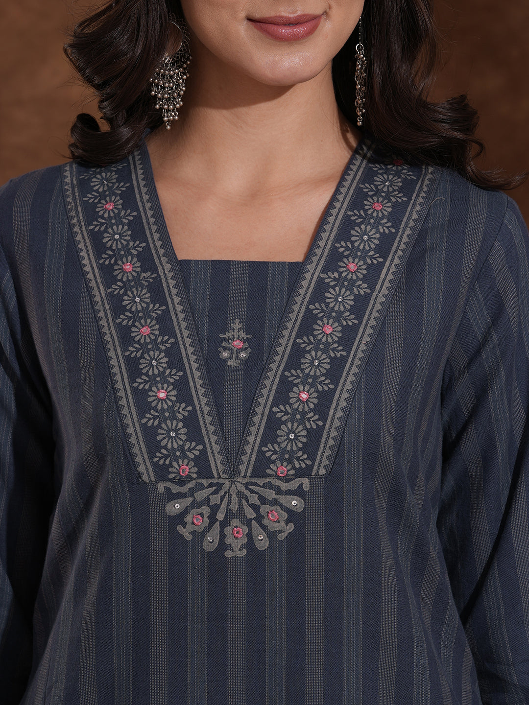 Straight fit kurta with mirror work paired with solid pant and printed dupatta.