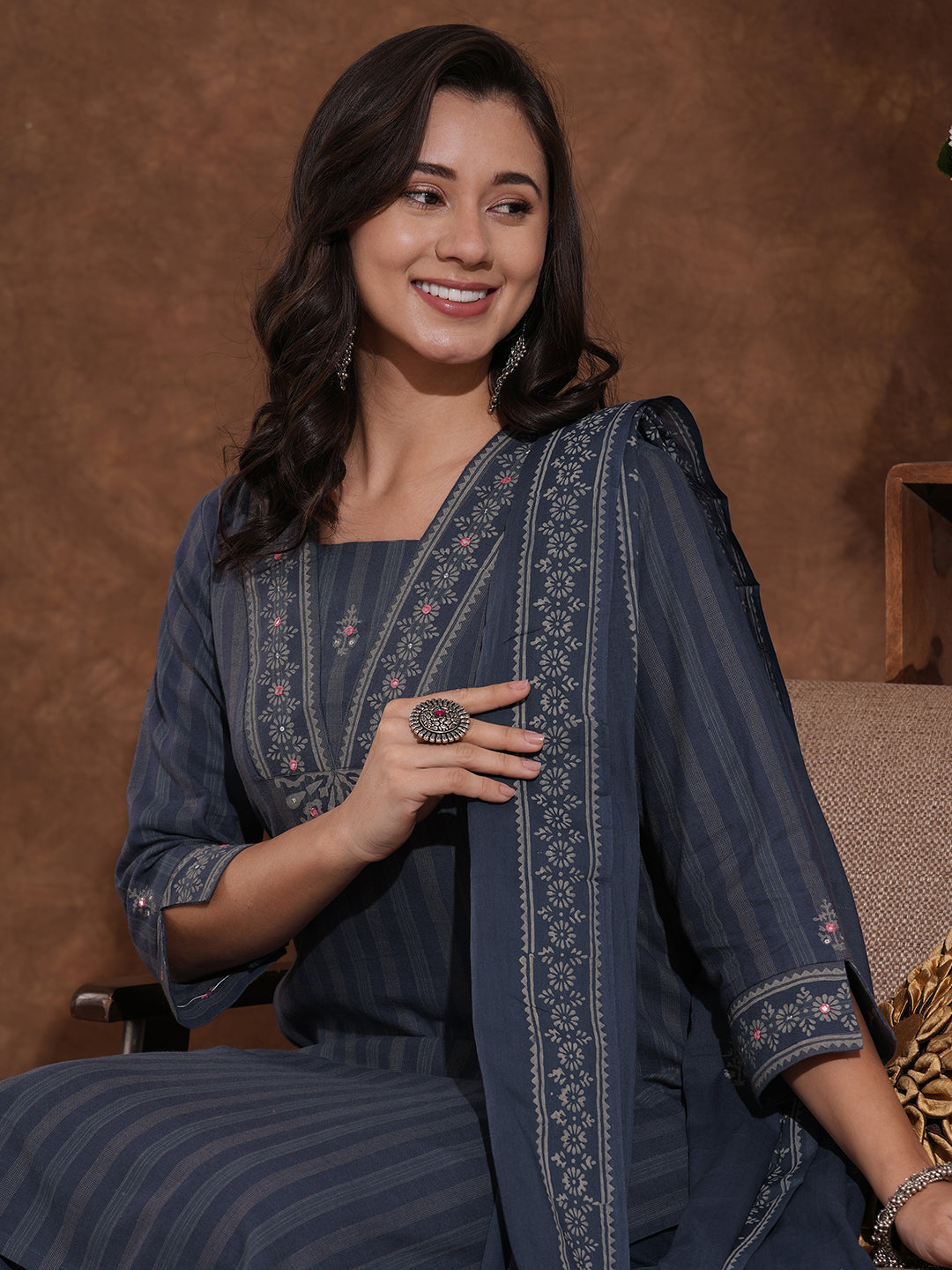 Straight fit kurta with mirror work paired with solid pant and printed dupatta.