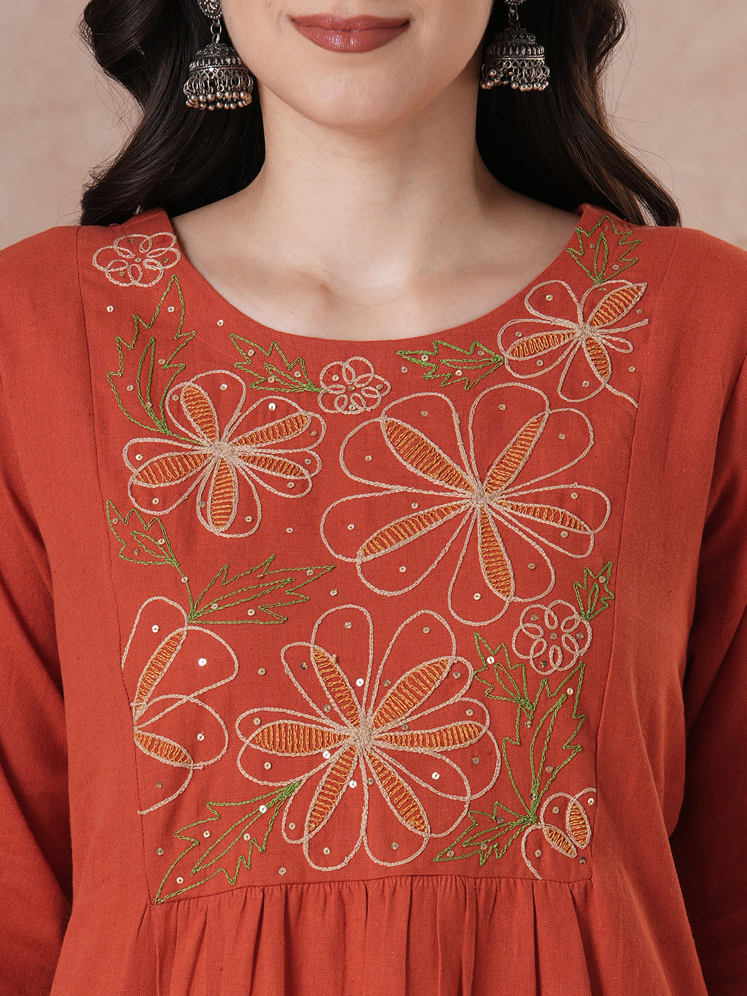 Rust Orange A-Line Kurta Set with Intricate Embroidered Yoke, Printed Dupatta and Matching Solid Pants.
