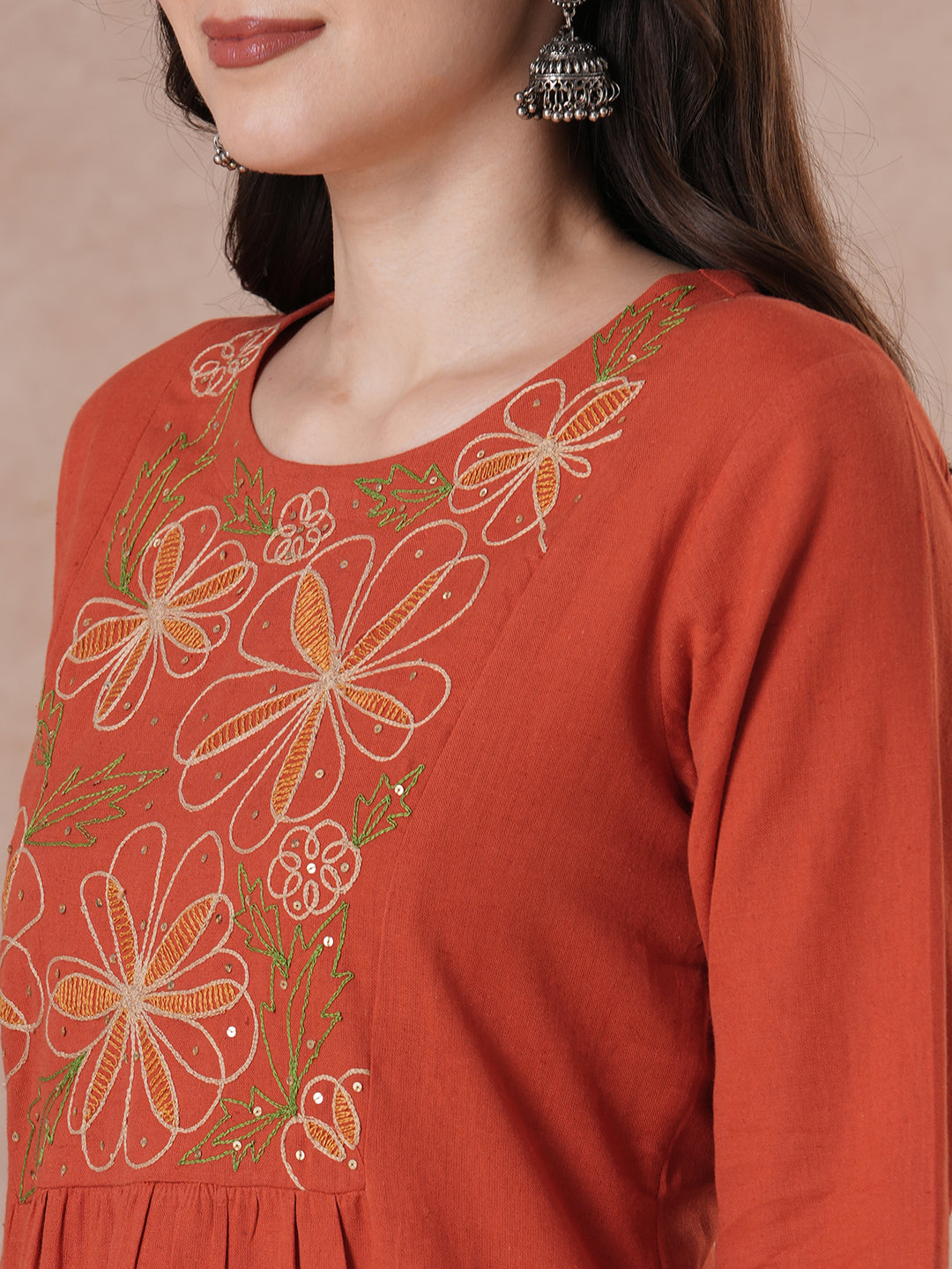 Rust Orange A-Line Kurta Set with Intricate Embroidered Yoke, Printed Dupatta and Matching Solid Pants.