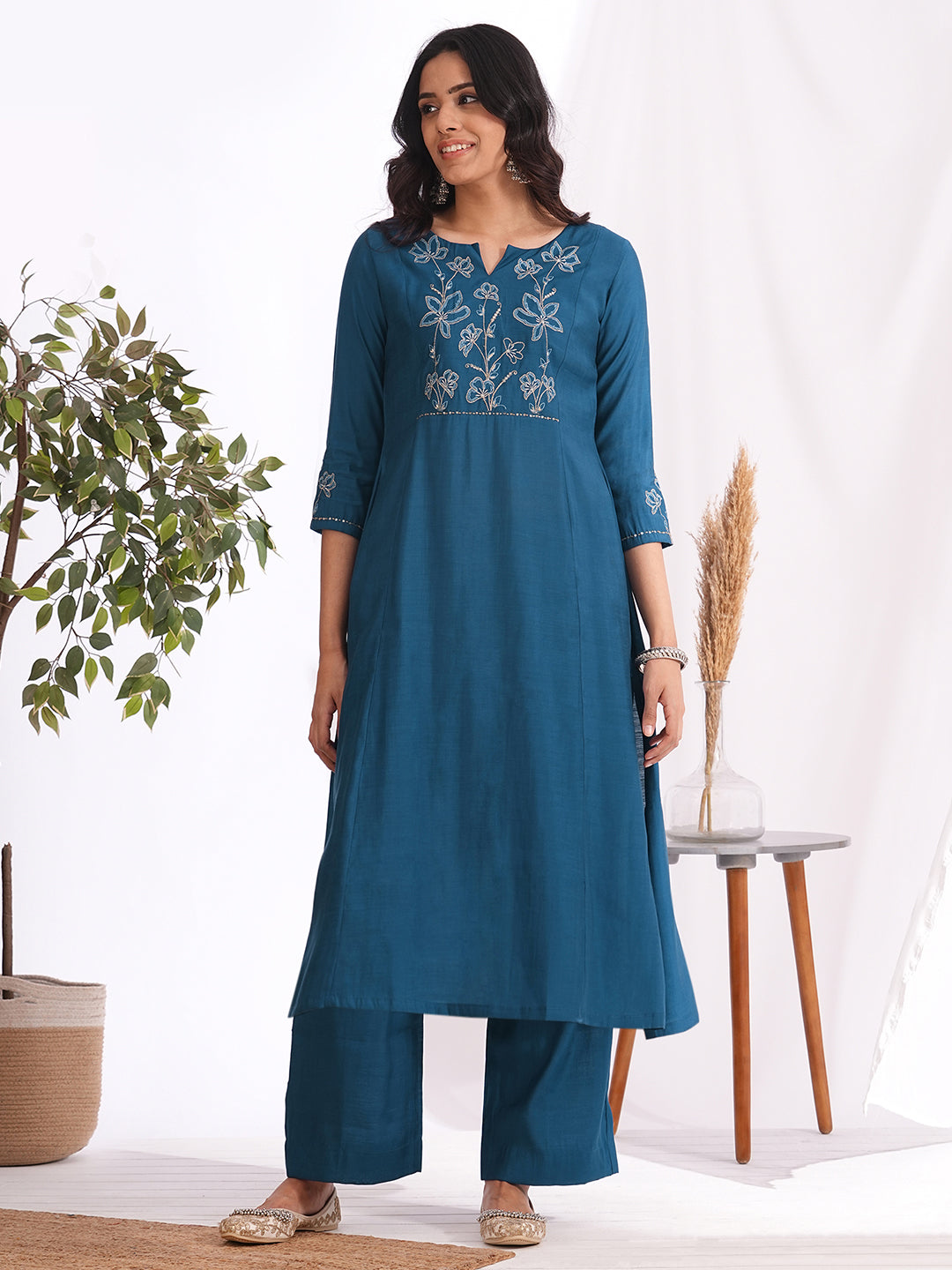 Pocketed A-line kurta in art silk fabric with zari and thread embroidery