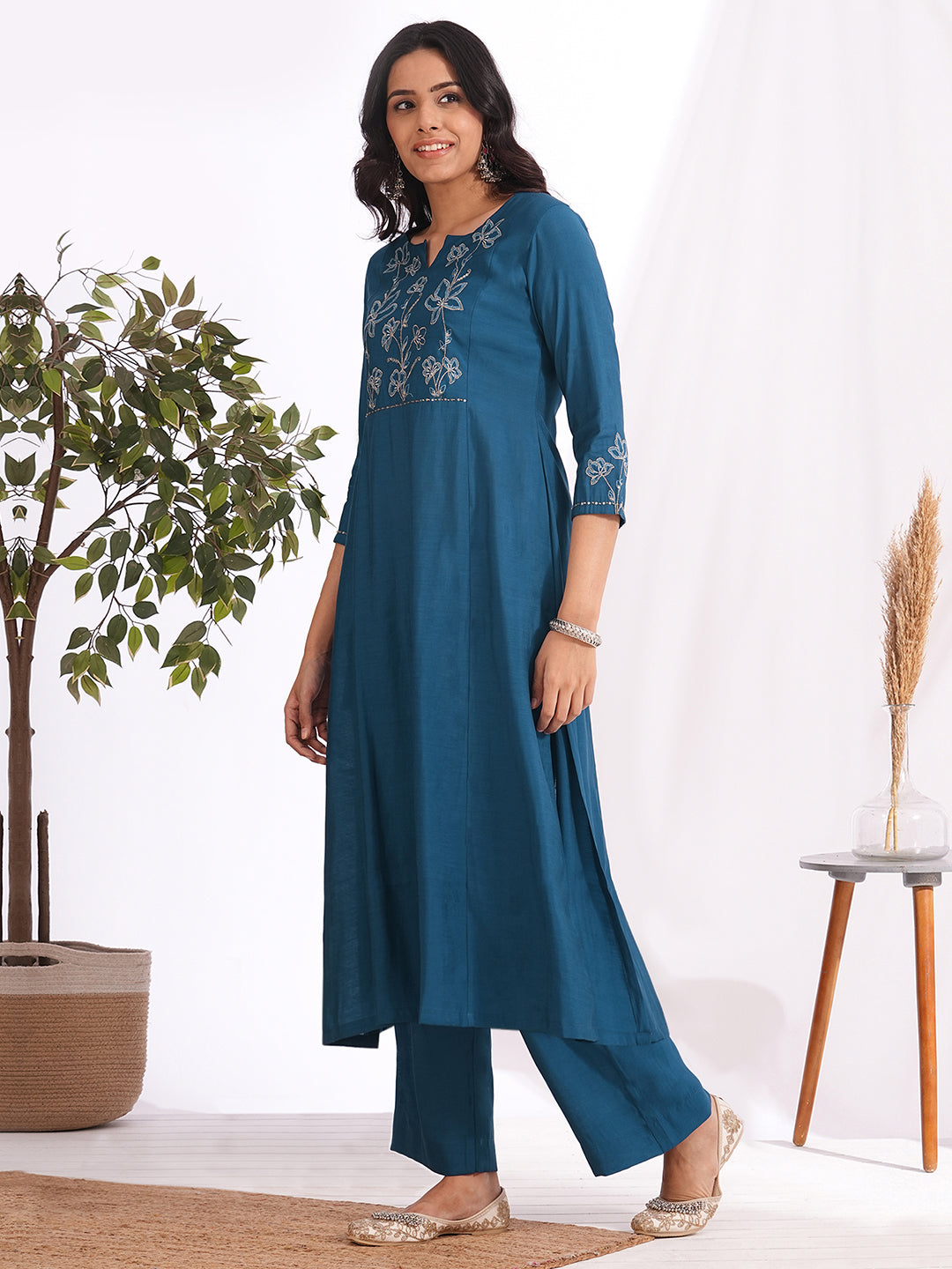Pocketed A-line kurta in art silk fabric with zari and thread embroidery