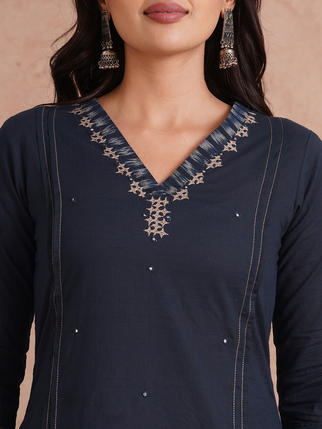 Pocketed A-Line cotton kurta with traditional 'chatakla' embroidery and mirror work.