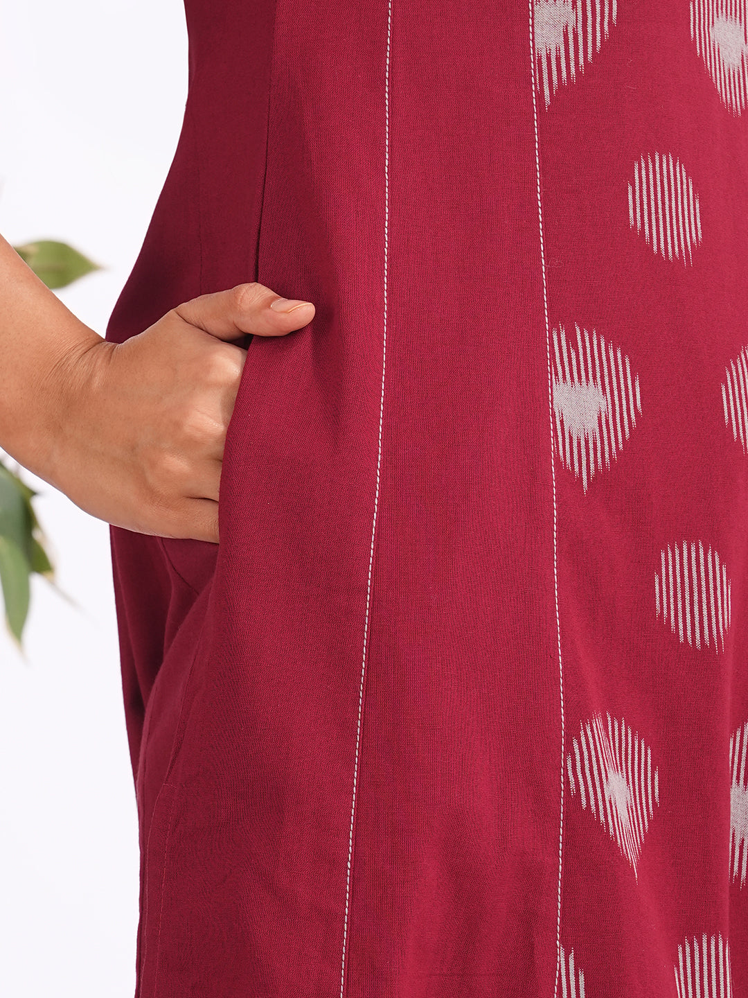 Pocketed A-line cotton kurta with a printed centre panel and hand work detailing (Maroon)