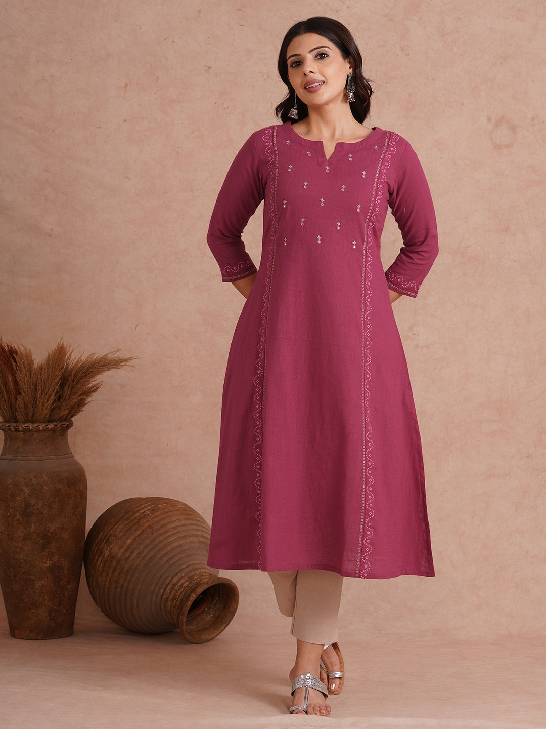 A-Line fit cotton slurb kurta with hand embroidery, block print and an inseam pocket.