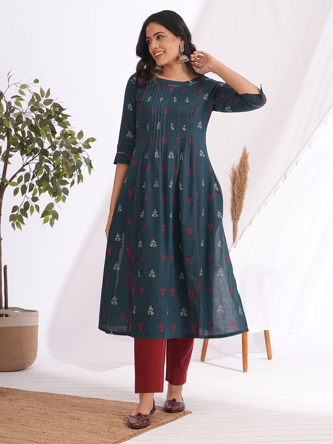 A-line pleated kurta with an printed cotton fabric with hand embroidery and pocket