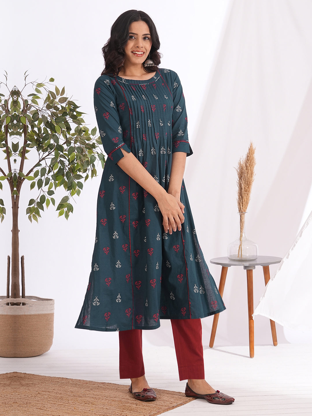 A-line pleated kurta with an printed cotton fabric with hand embroidery and pocket