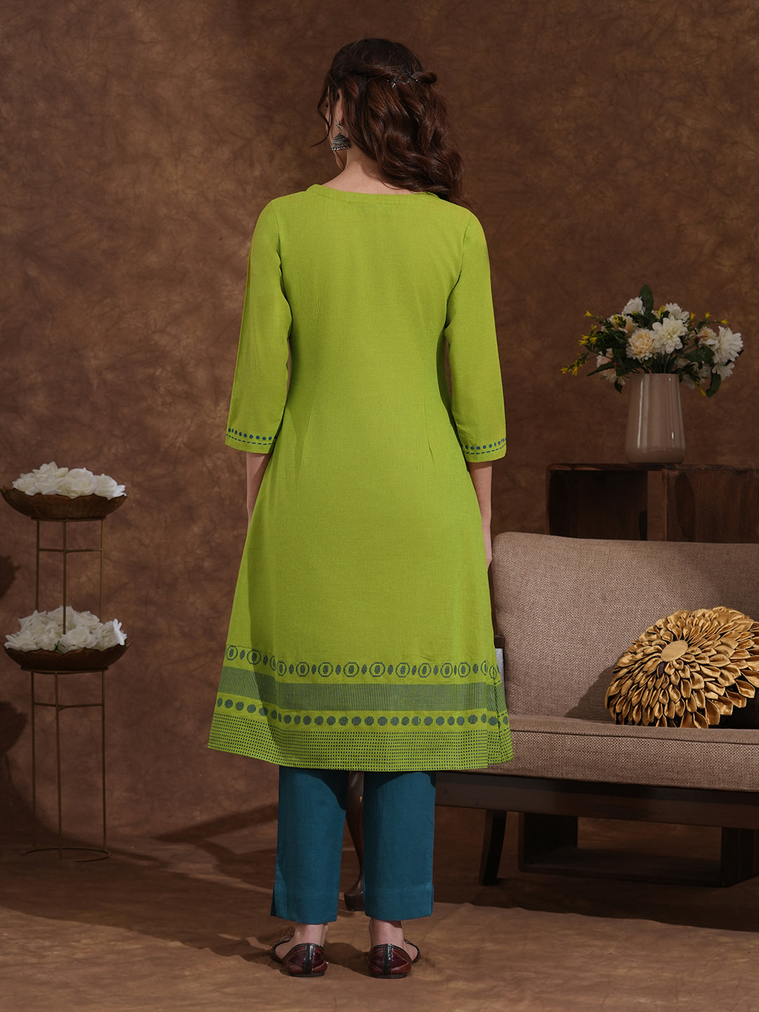 A-line kurta in woven cotton fabric with geometric block print and a side pocket.