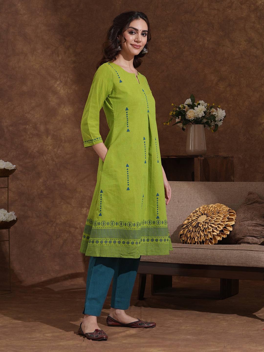 A-line kurta in woven cotton fabric with geometric block print and a side pocket.