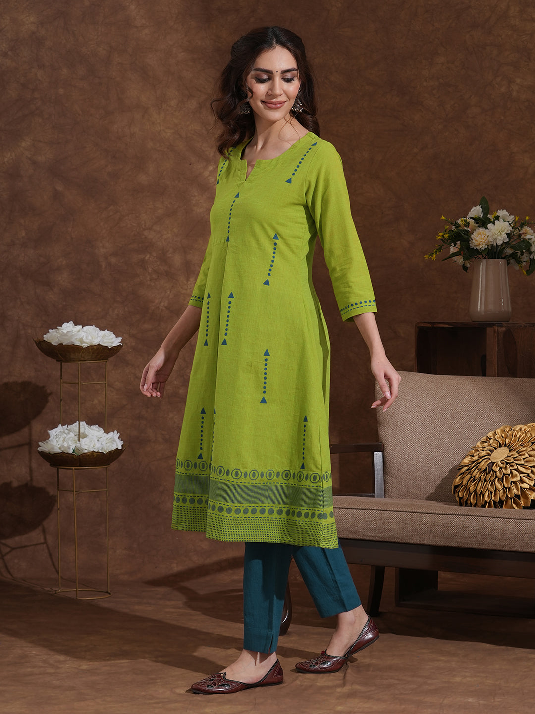 A-line kurta in woven cotton fabric with geometric block print and a side pocket.