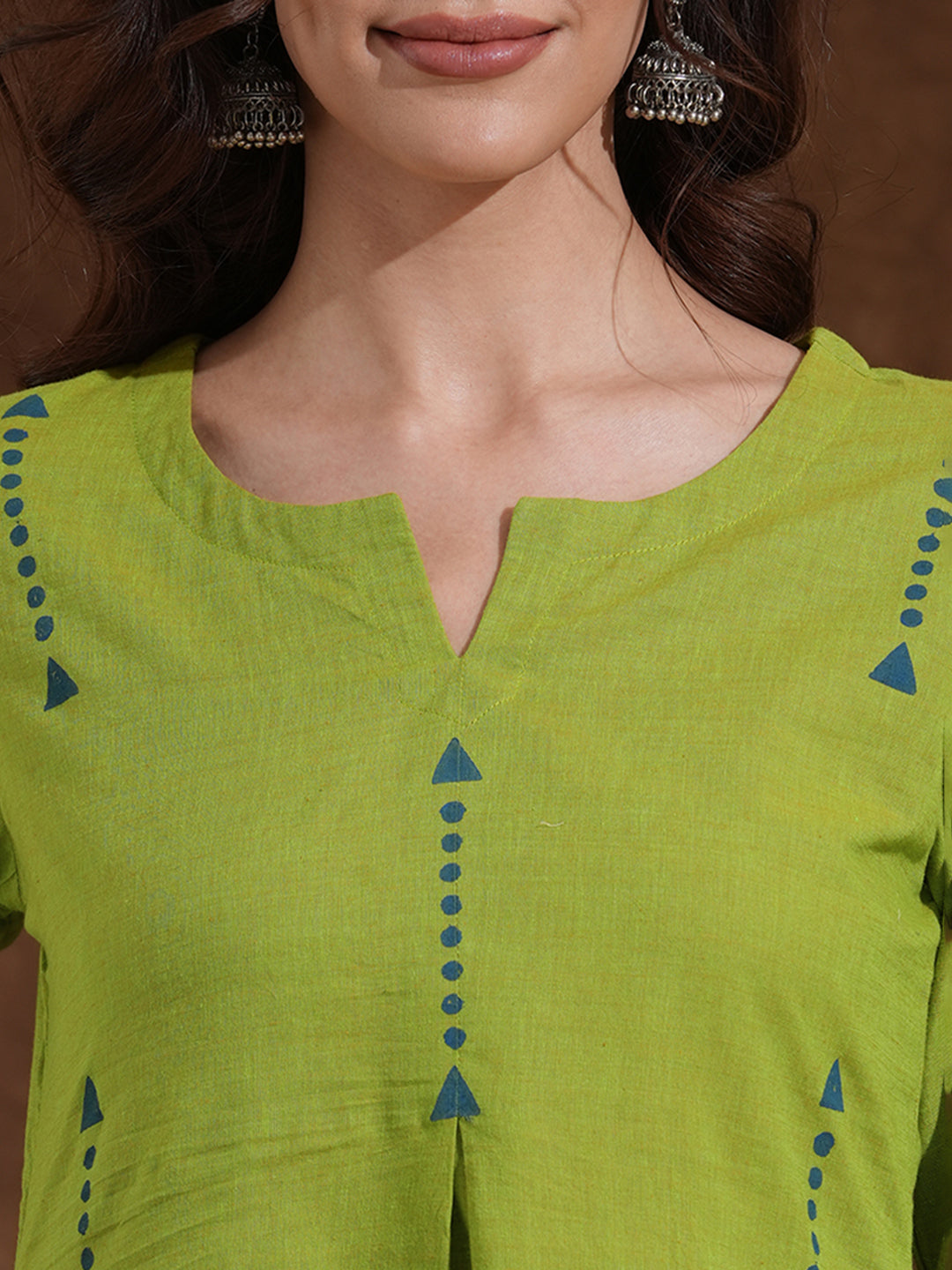 A-line kurta in woven cotton fabric with geometric block print and a side pocket.
