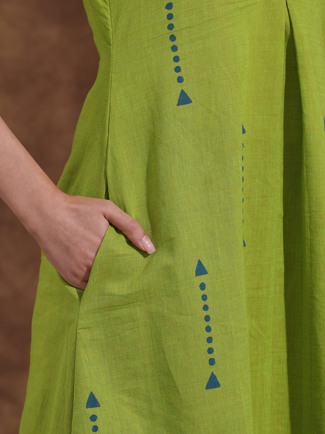 A-line kurta in woven cotton fabric with geometric block print and a side pocket.