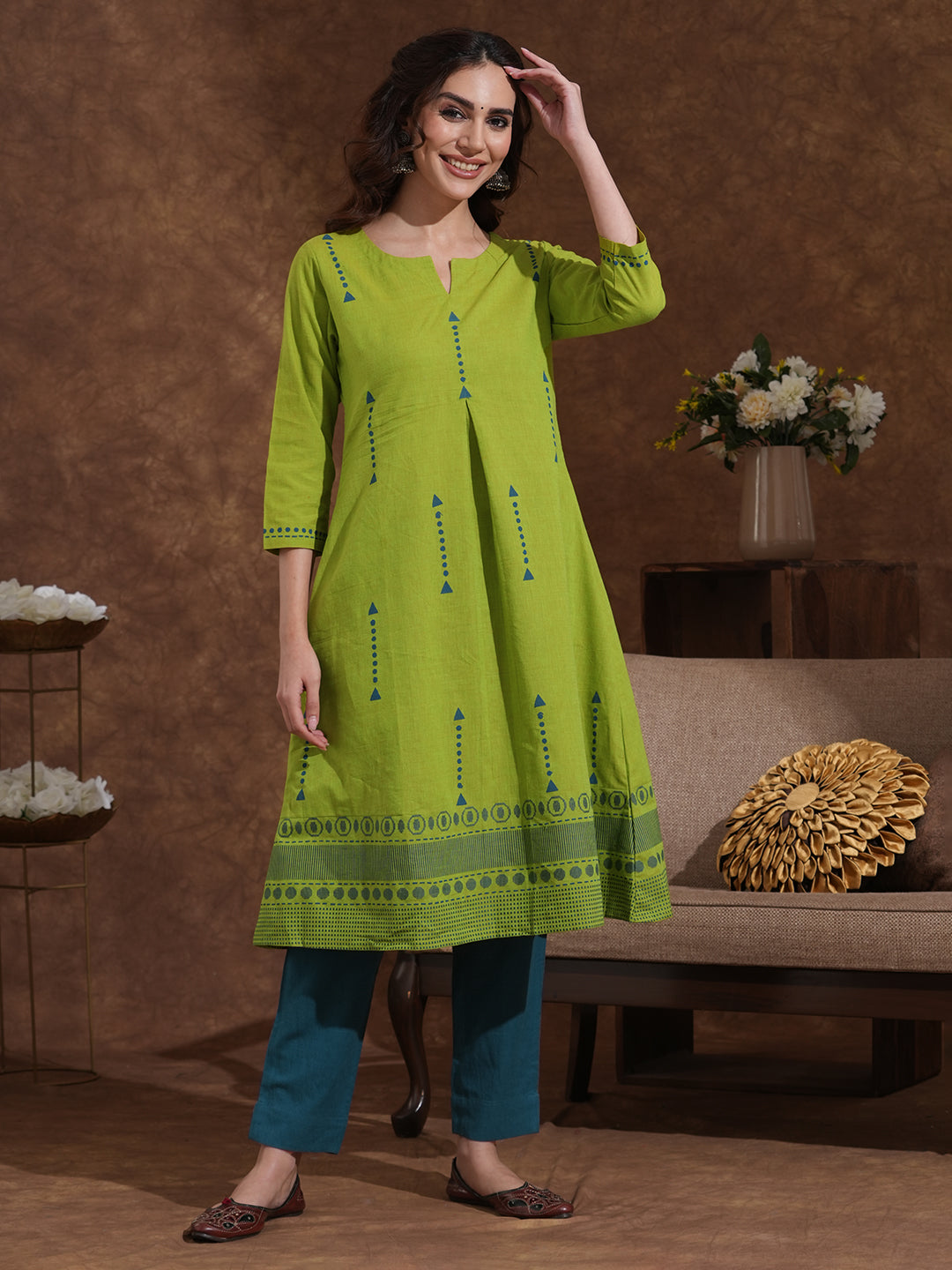 A-line kurta in woven cotton fabric with geometric block print and a side pocket.