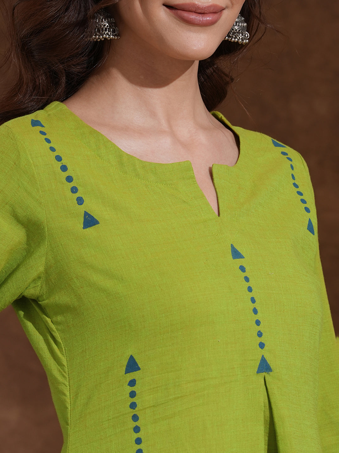 A-line kurta in woven cotton fabric with geometric block print and a side pocket.