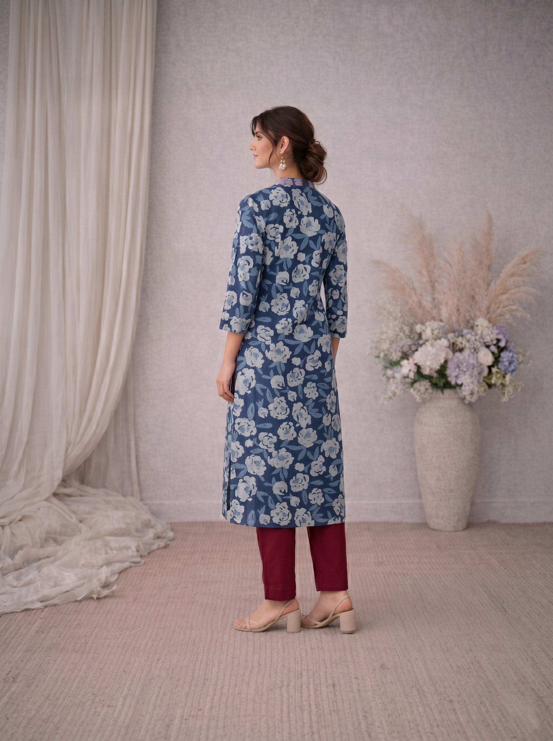 Pocketed A-line kurta in cotton dhabu print with hand embroidery detailing.