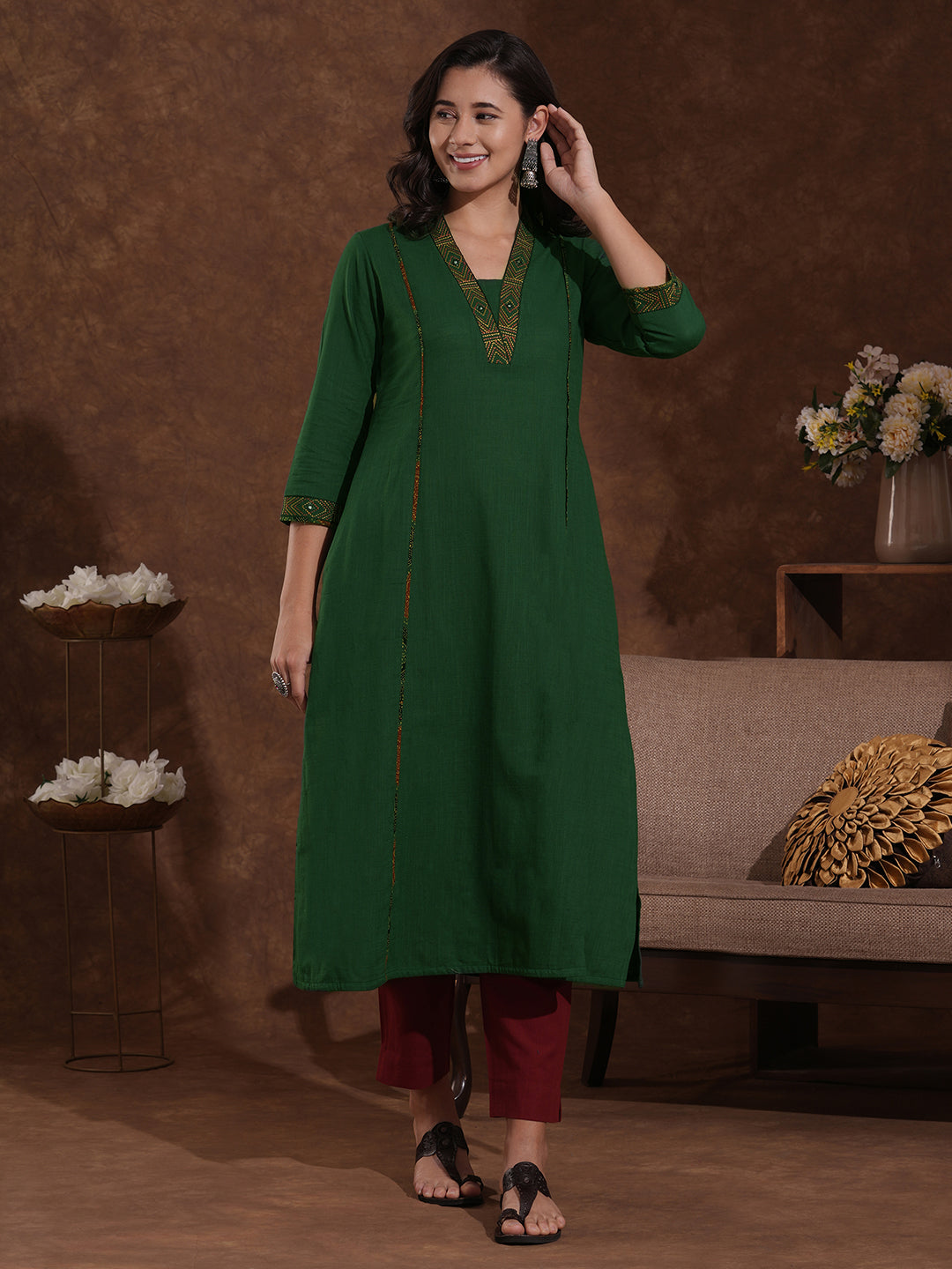 Pocketed A line cotton slurb kurta with thread and mirror embroidery.