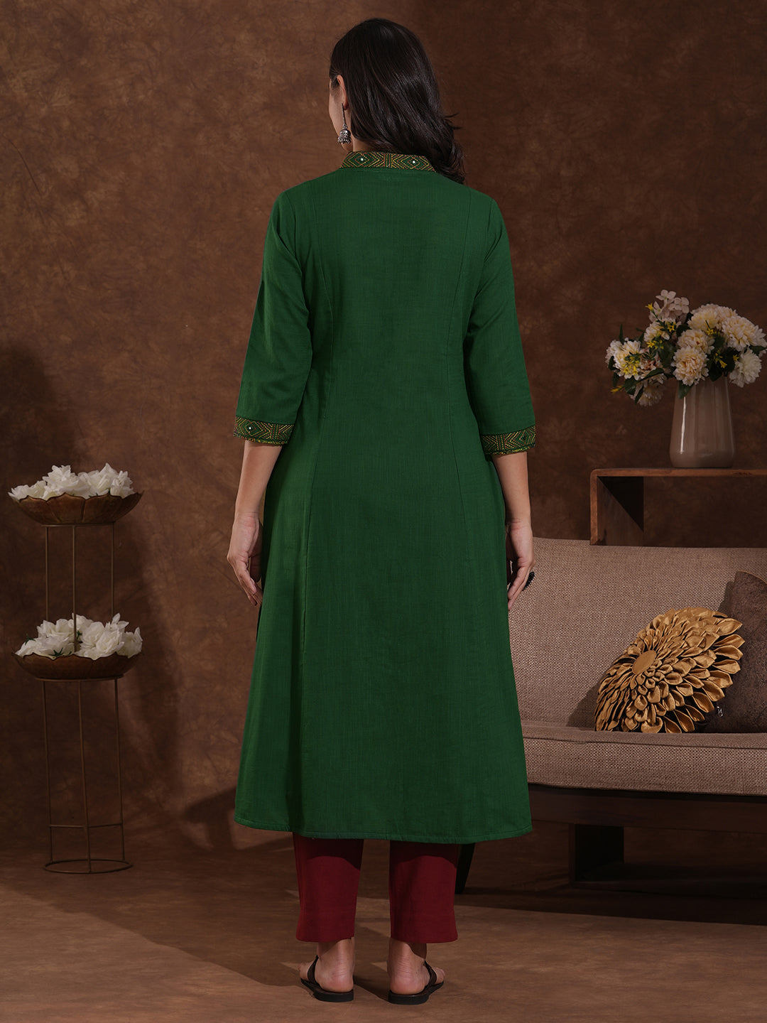 Pocketed A line cotton slurb kurta with thread and mirror embroidery.