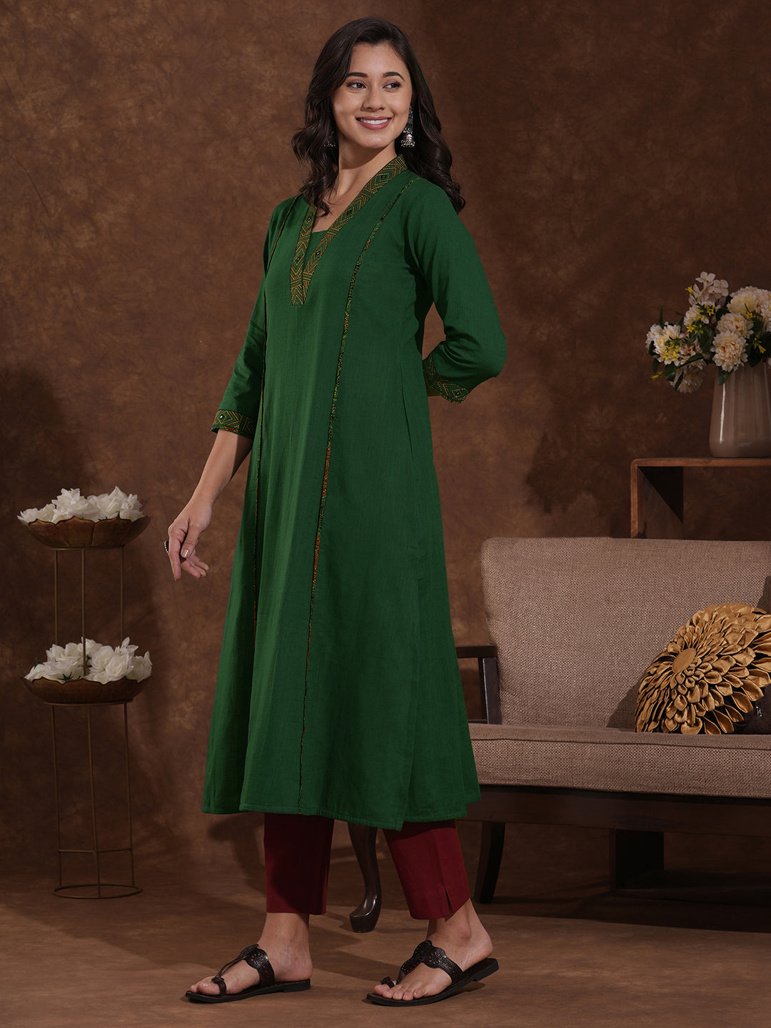 Pocketed A line cotton slurb kurta with thread and mirror embroidery.