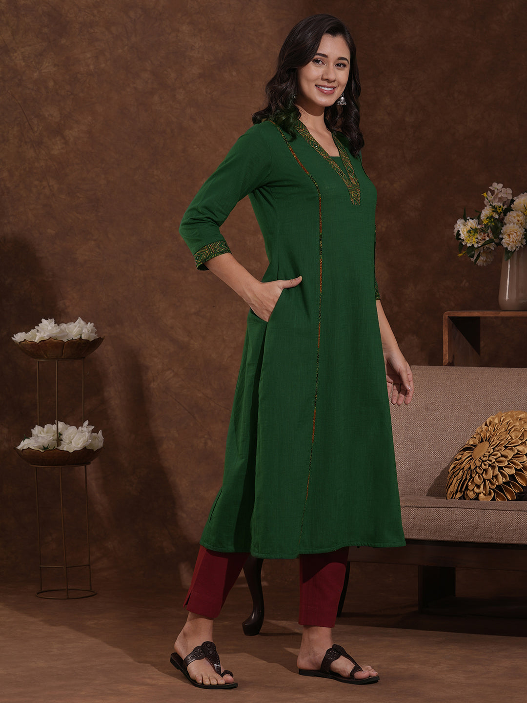 Pocketed A line cotton slurb kurta with thread and mirror embroidery.
