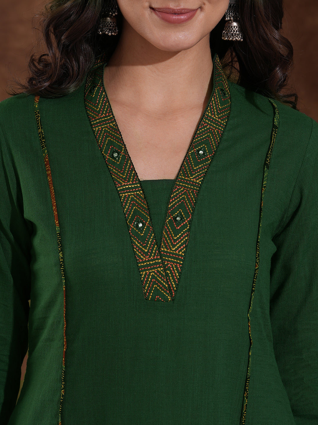 Pocketed A line cotton slurb kurta with thread and mirror embroidery.