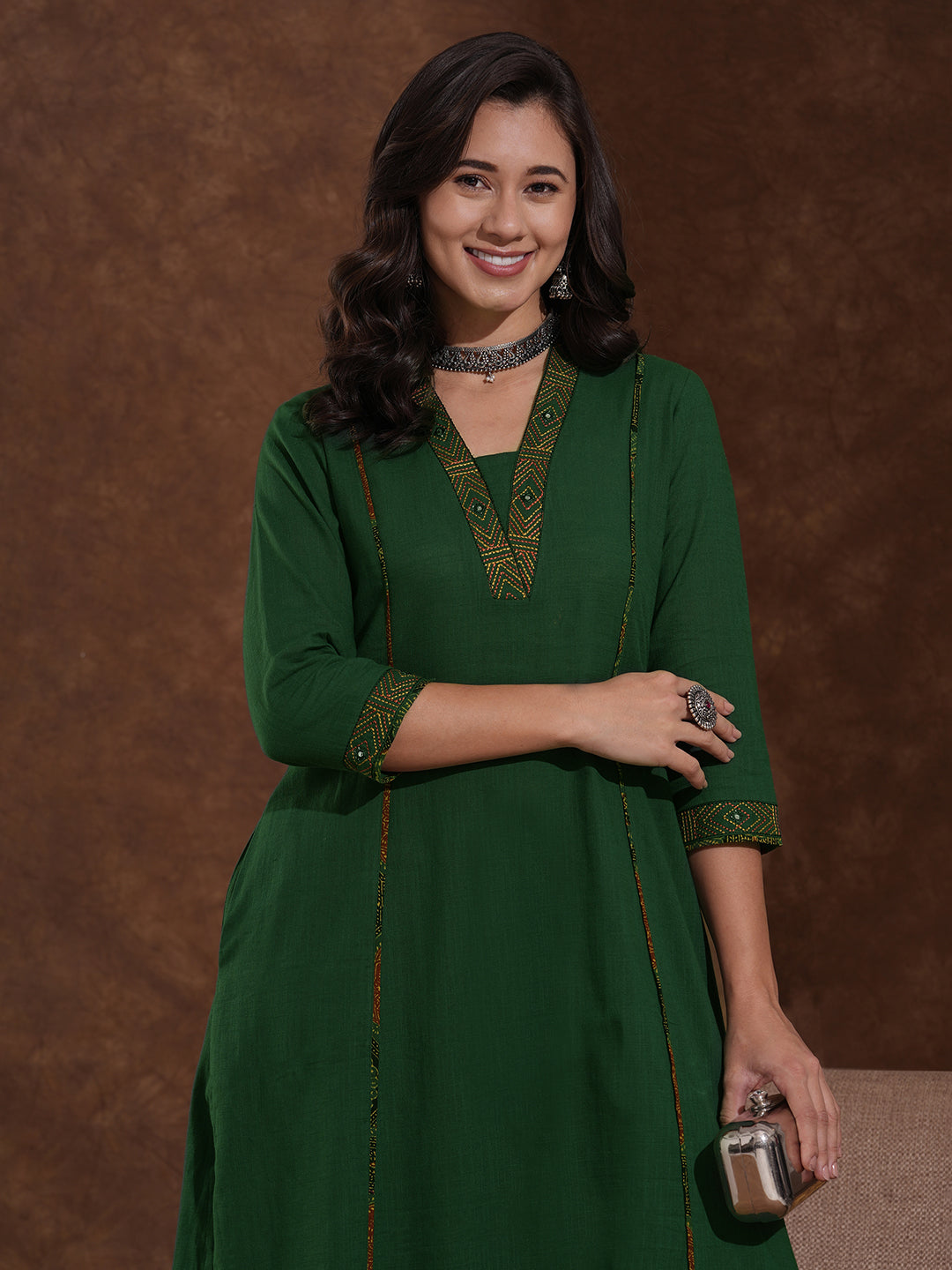 Pocketed A line cotton slurb kurta with thread and mirror embroidery.