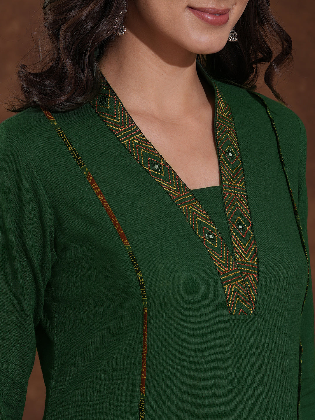 Pocketed A line cotton slurb kurta with thread and mirror embroidery.