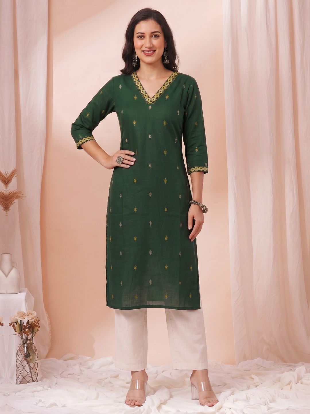 Women Green Straight Fit Cotton Woven Kurta with Embroidered Neckline & Sleeves.