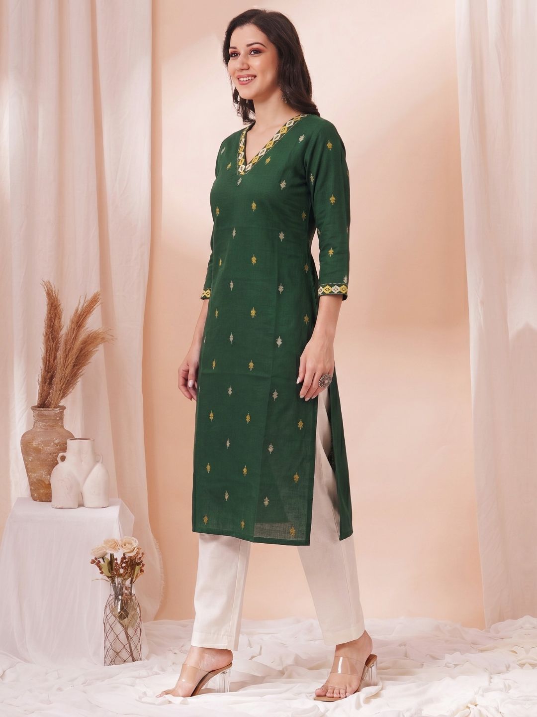 Women Green Straight Fit Cotton Woven Kurta with Embroidered Neckline & Sleeves.