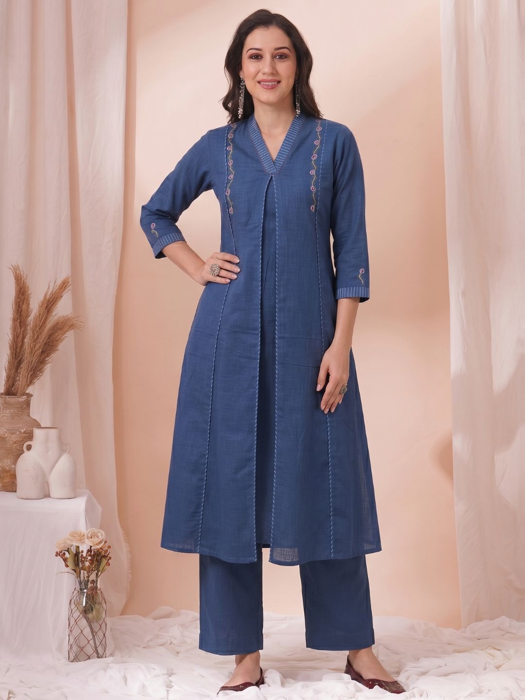 A-Line Cotton Kurta with Elegance Floral Embroidered Yoke and Contrast Piping Detailing.