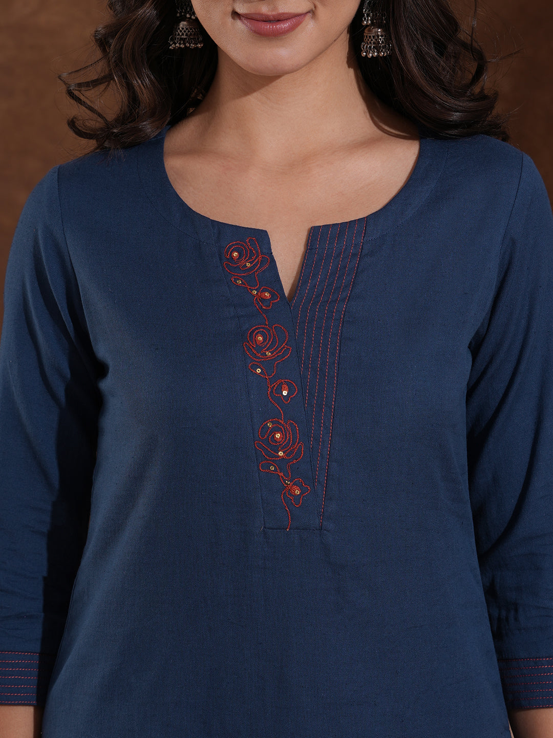 Embroidered straight fit kurta in cotton flex with sequin work.