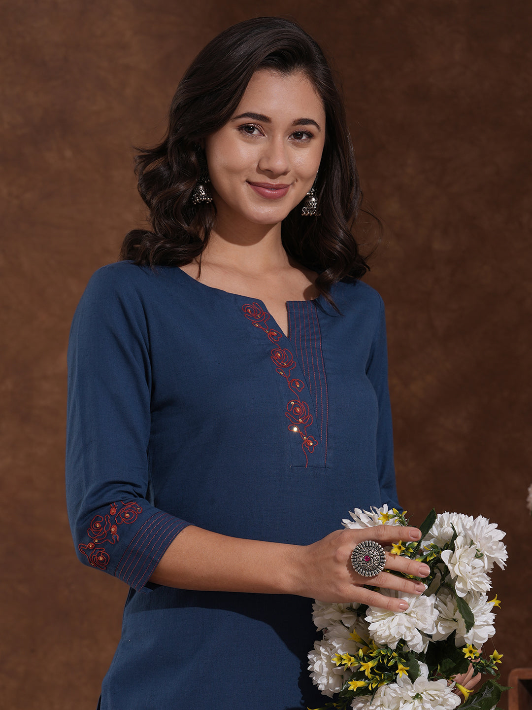 Embroidered straight fit kurta in cotton flex with sequin work.