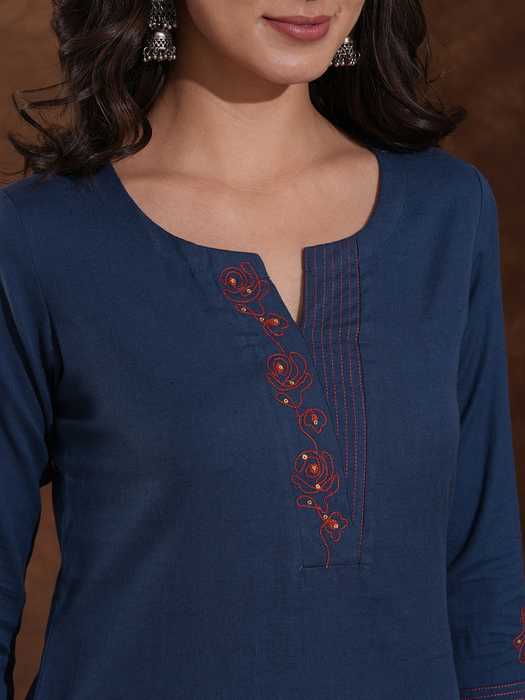 Embroidered straight fit kurta in cotton flex with sequin work.