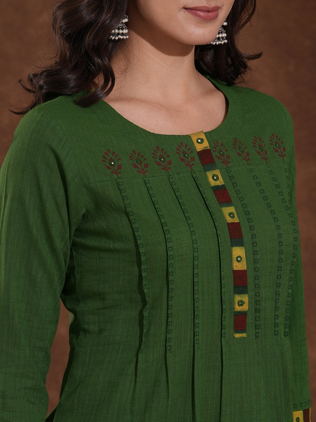 Straight fit kurta with block printed shoulder yoke and tucks in the front with ajarakh trim fabric.