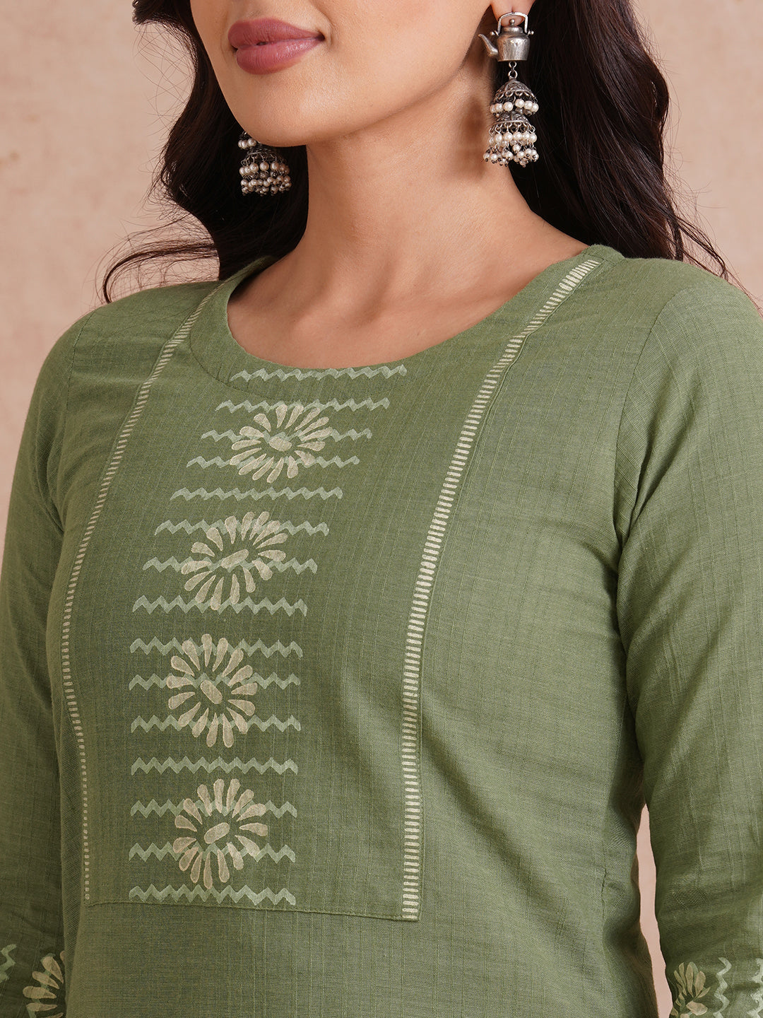Straight fit kurta with block printed yoke and sleeves.