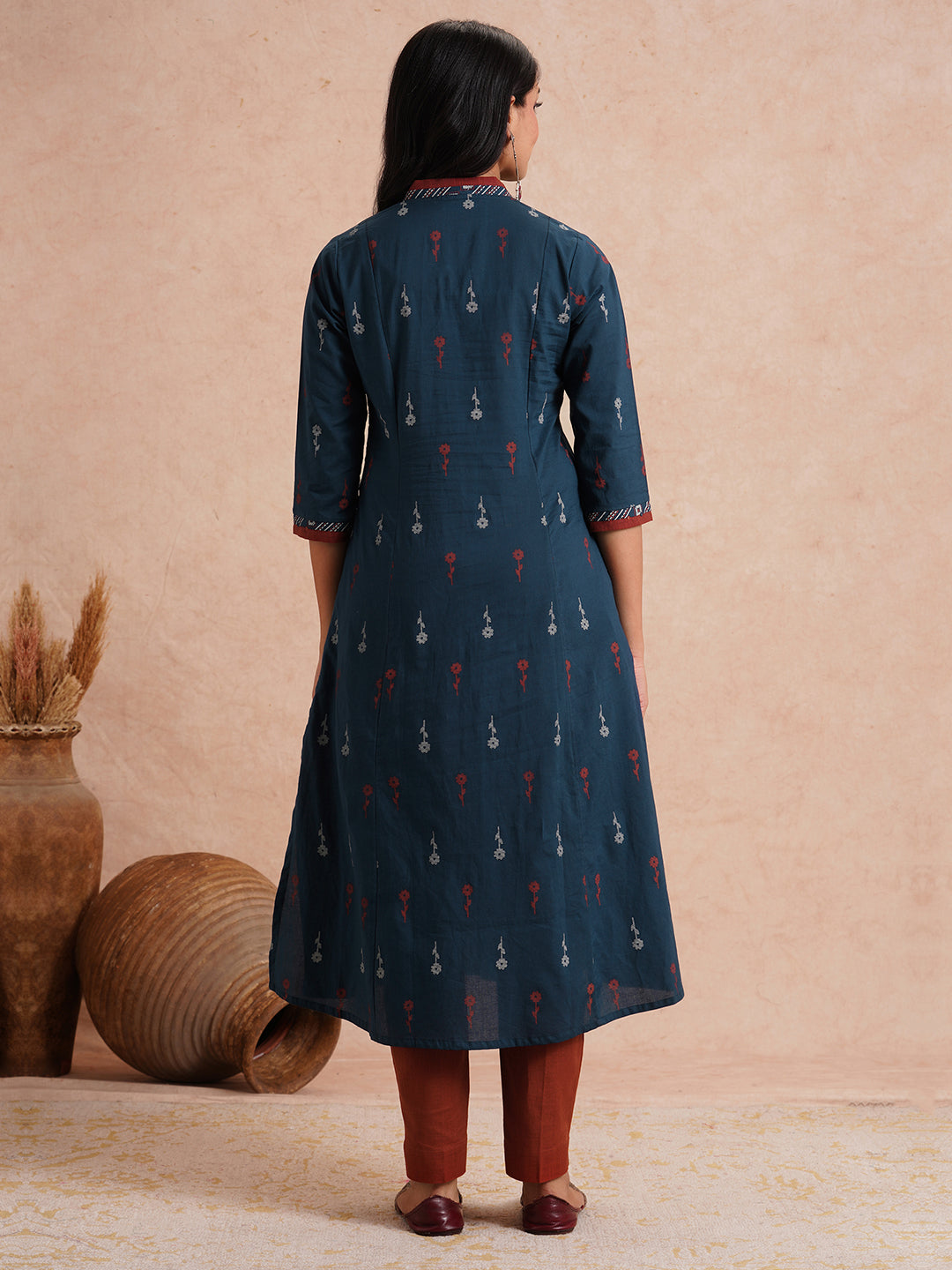 Printed A-line kurta with contrast fabric detailing with mirror work.
