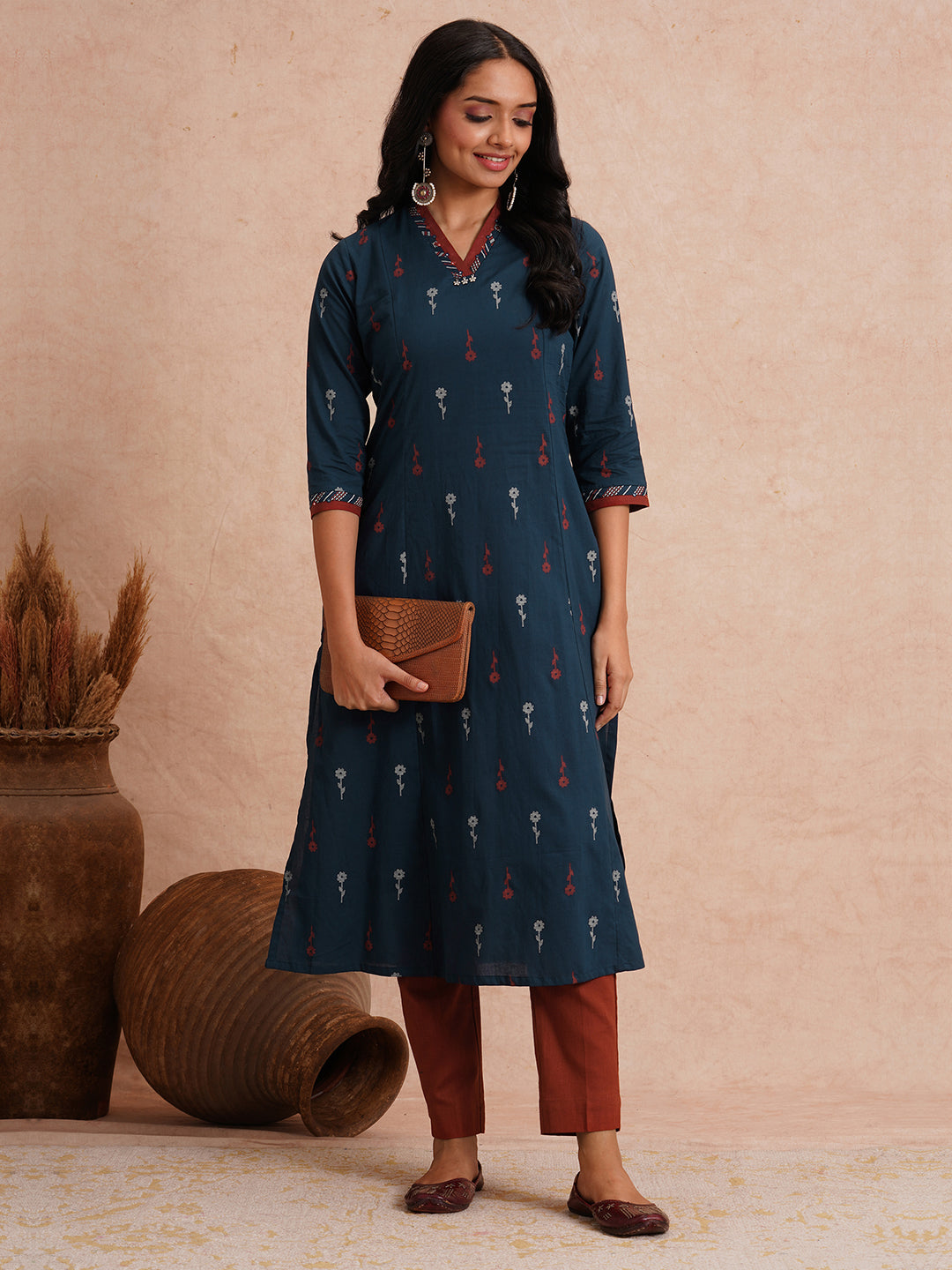 Printed A-line kurta with contrast fabric detailing with mirror work.