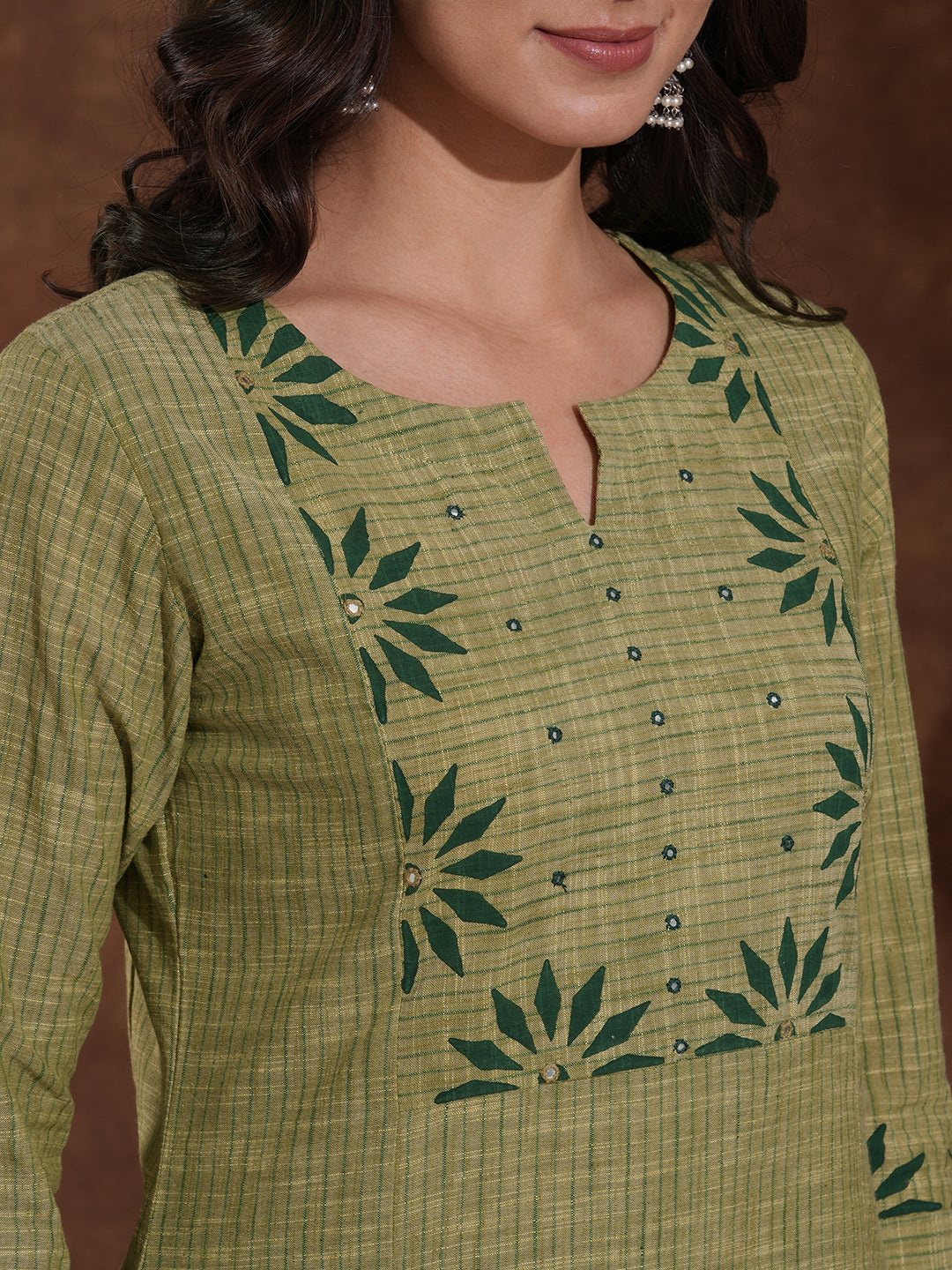 Straight fit kurta in woven stripes with block printed yoke and sleeves.