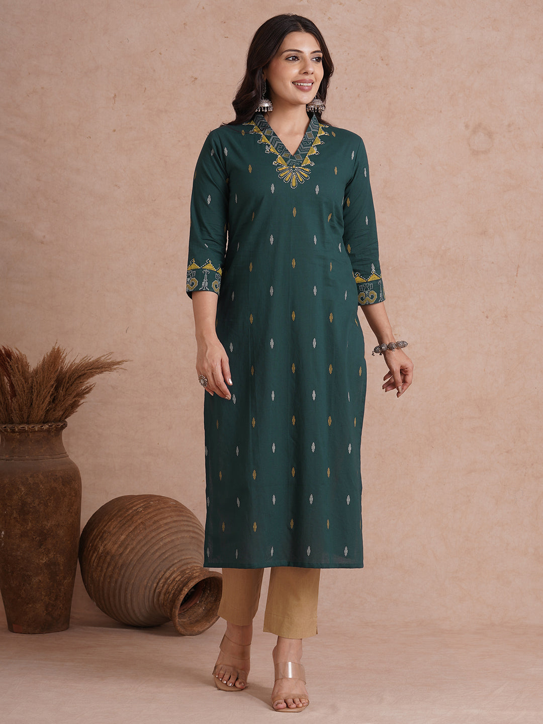 Straight fit cotton printed kurta with block printed neckline and sleeves.